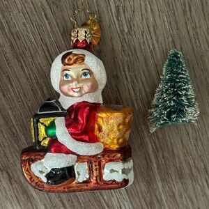 Vintage Radko Homeward Bound Gem Boy On Sled with a Tree Holiday Ornament